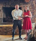 Leach receiving award